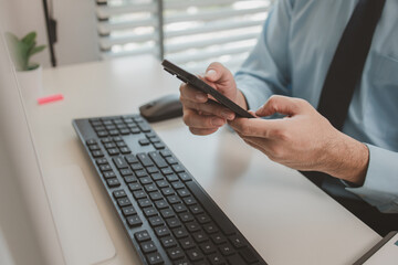 an entrepreneur is working diligently in an office, a businessman is using a smartphone to take a photo of a document, the manager is reviewing a document, marketing, company, accountant