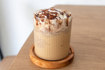 Coffee almond frappe with chocolate sauce and whipped cream on top. Iced almond chocolate Frappe