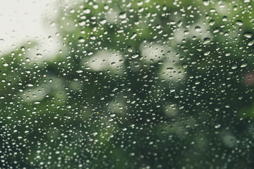 Water droplets on the glass on a natural background