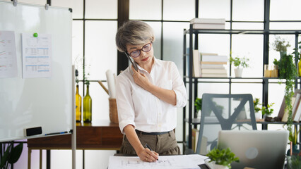 Senior business asian woman mature working in office
