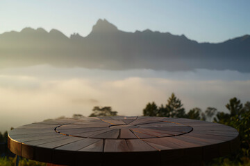 Levitation Spoon on Wooden Platform Amidst Misty Mountains 