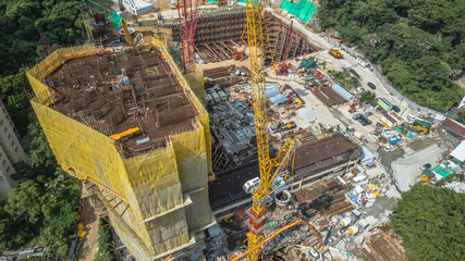 July 26 2025 Modern Construction Site With Tower Cranes and Urban Buildings