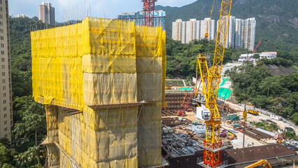July 26 2025 Modern Construction Site With Tower Cranes and Urban Buildings