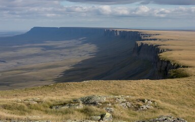 Vast plateau with sheer cliffs and rolling grasslands