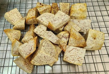 Raw Taro Cubes on a Metal Cooling Rack