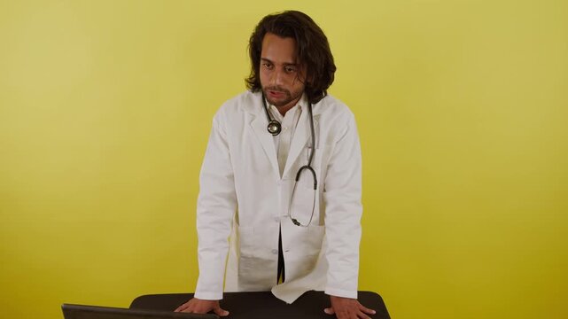 Surgeon Instructs Student Beside Open System