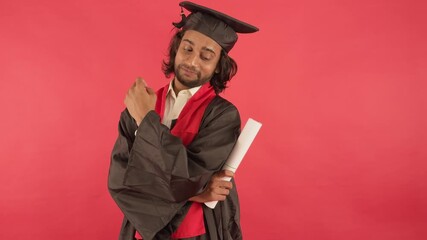 Scholar in academic dress holds document proudly