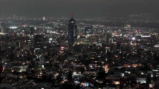 shot of night lights in mexico city buildings
