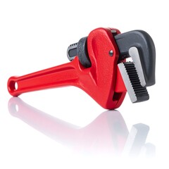 Red pipe wrench on white background