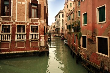 View of the wonderful small canals, distributed throughout the neighborhoods of Venice, Italy.