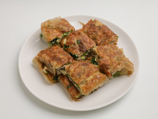 Thin pastry filled with meat, egg and spring onion and fried