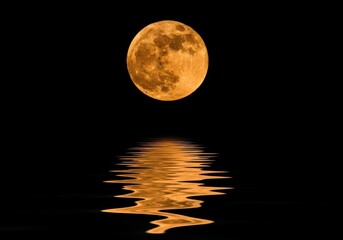 A full orange moon glowing in the dark night sky, reflected on the rippling surface of the water