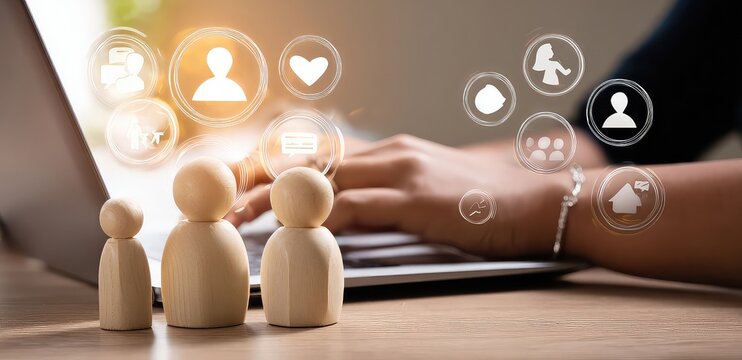 Wooden figures in front of a laptop with social media icons overlaid on the screen and background