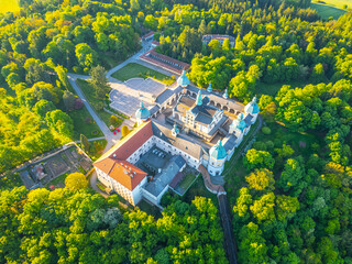 Holy Mountain in Pribram features a stunning Baroque complex surrounded by lush greenery. This site serves as a significant pilgrimage destination in Czechia, attracting visitors year-round.
