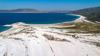 The tranquil beauty of Salda Lake - Turkey with its crystal clear turquoise waters and stunning surrounding landscapes is a mesmerizing sight to behold.