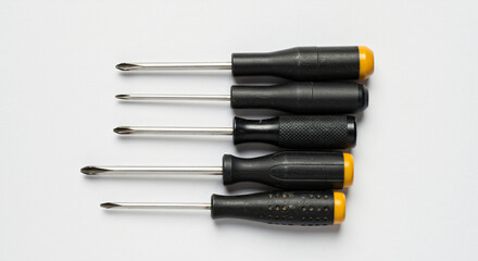 Black and Yellow Screwdriver Set with Matching Grip Design in a Flat Lay Formation