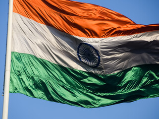 India flag flying high at Connaught Place with pride with plain white background, India flag fluttering, Indian Flag on Independence Day and Republic Day of India, tilt up shot, Har Ghar Tiranga