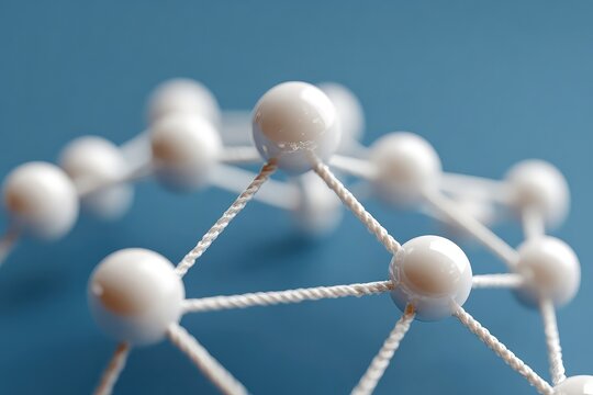 Aerial view of diverse business team around round table with hands on documents in a meeting