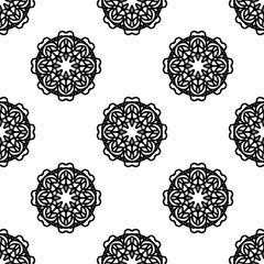 Seamless black and white mandala pattern perfect for backgrounds, textiles, and digital art. Features intricate floral-inspired motifs for elegant design.