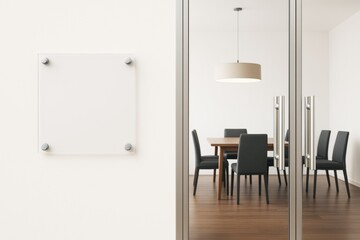 Modern office interior with glass door and blank wall sign near a contemporary meeting room with wooden floor and minimalist furniture.