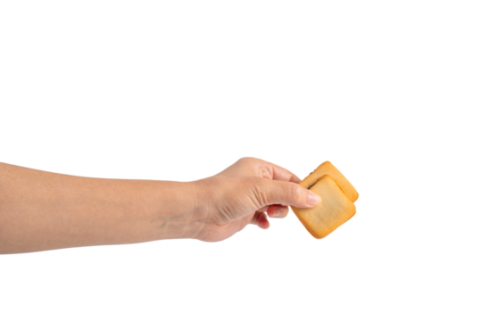 Square crispy snack in hand on transparent background
