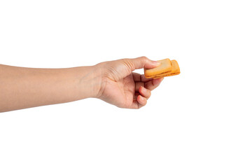 Square crispy snack in hand on transparent background