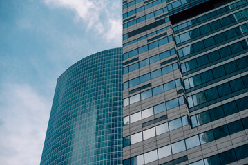 walls and empty windows of a modern building on a big city street without people