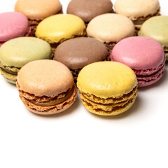 Small colorful tasty sweet original classic macaroons cakes isolated on white studio background