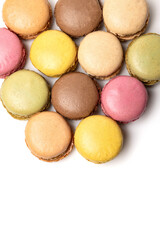 Small colorful tasty sweet original classic macaroons cakes isolated on white studio background