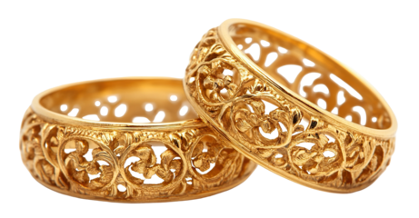 Pair of two ornate golden rings, isolated on transparent cutout background