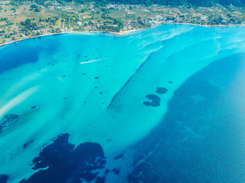 Seacoast with shades of turquoise water with beaches and blue lagoons in Karidi in Sithonia Peninsula, Vourvourou bay, Halkidiki, North Greece