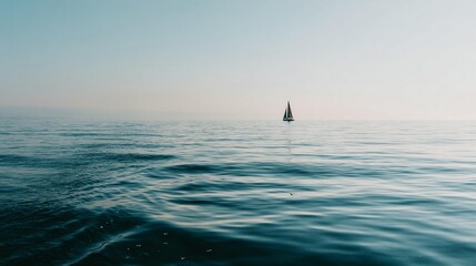 Naklejka premium Sailboat on calm ocean water