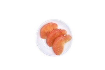 Pomelo pulp, pomelo variety, on a white plate