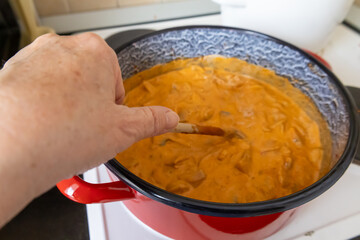 Stirring creamy mushroom stew
