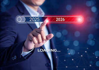 A man is loading year 2025 to 2026 by placing his finger on a screen. He has made a new idea to develop his job or business. 