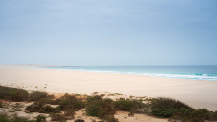 Scenic sand dunes and Atlantic blue ocean at Praia de Chaves (Chaves beach), Boa Vista, Cabo Verde (Cape Verde)
