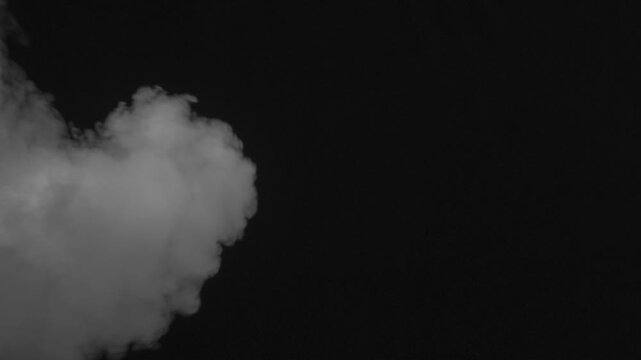 Soft Rolling Smoke Effect. A stream of white smoke flows out trying to fill the screen, but is blown off the screen by the air flow