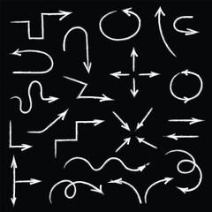 A set of white arrows in different directions on a black background, arrows drawn with charcoal, marker, or brush