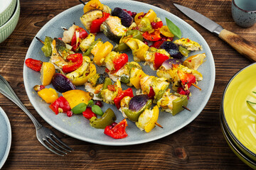 Fish skewers on a BBQ.