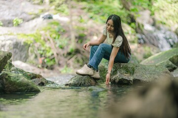 Woman Enjoys Nature by Waterfall in North and South Jetkot Area