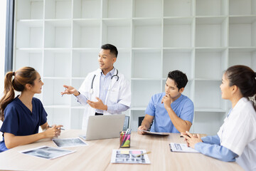 Medical team brainstorming having a meeting in conference room at hospital, Medical technology and health care concept.