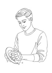 A young man is washing a plate with soap and water, with suds visible.