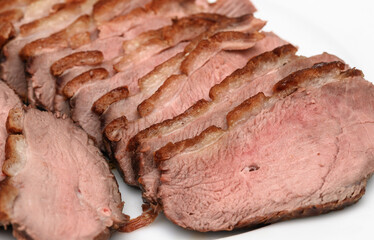 Perfectly fried duck breast, pink in the middle. Thin slices of fried duck.