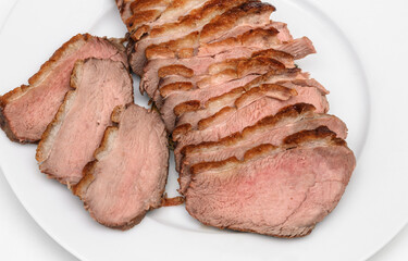 Grilled duck fillet cut into slices close-up