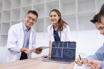 Medical team with laptop computer and examine x ray test results for treatment plans in a modern hospital, Healthcare and medical concept.