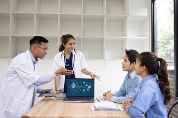 Medical team with laptop computer and examine x ray test results for treatment plans in a modern hospital, Healthcare and medical concept.