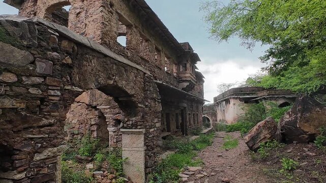 Abandoned Taragarh Fort Ruins with Overgrown Vegetation in Bundi Rajasthan, India 