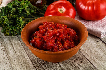 Diced ripe tomato with sauce