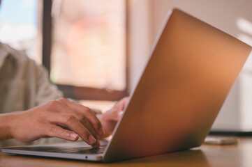 Fototapeta premium Close Up of Hands Typing on Laptop Keyboard Business Professional Working on Computer