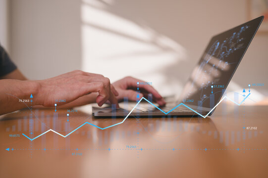 investment financial concept Business finance data analytics graph.Financial management technology.Advisor using KPI Dashboard on virtual screen, man using computer laptop working with data charts